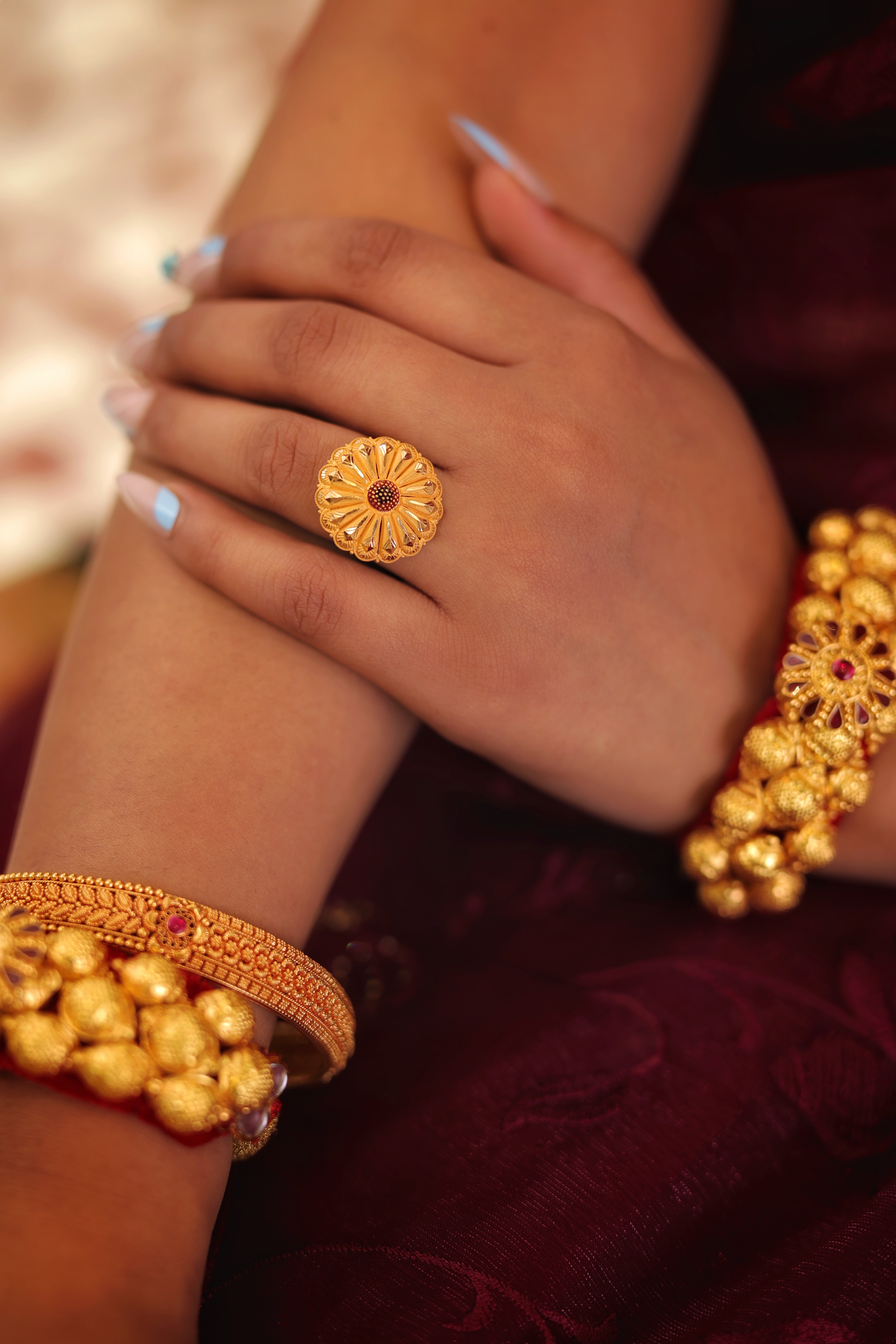 Traditional Floral Sunburst Cocktail Ring with Central Red Accents