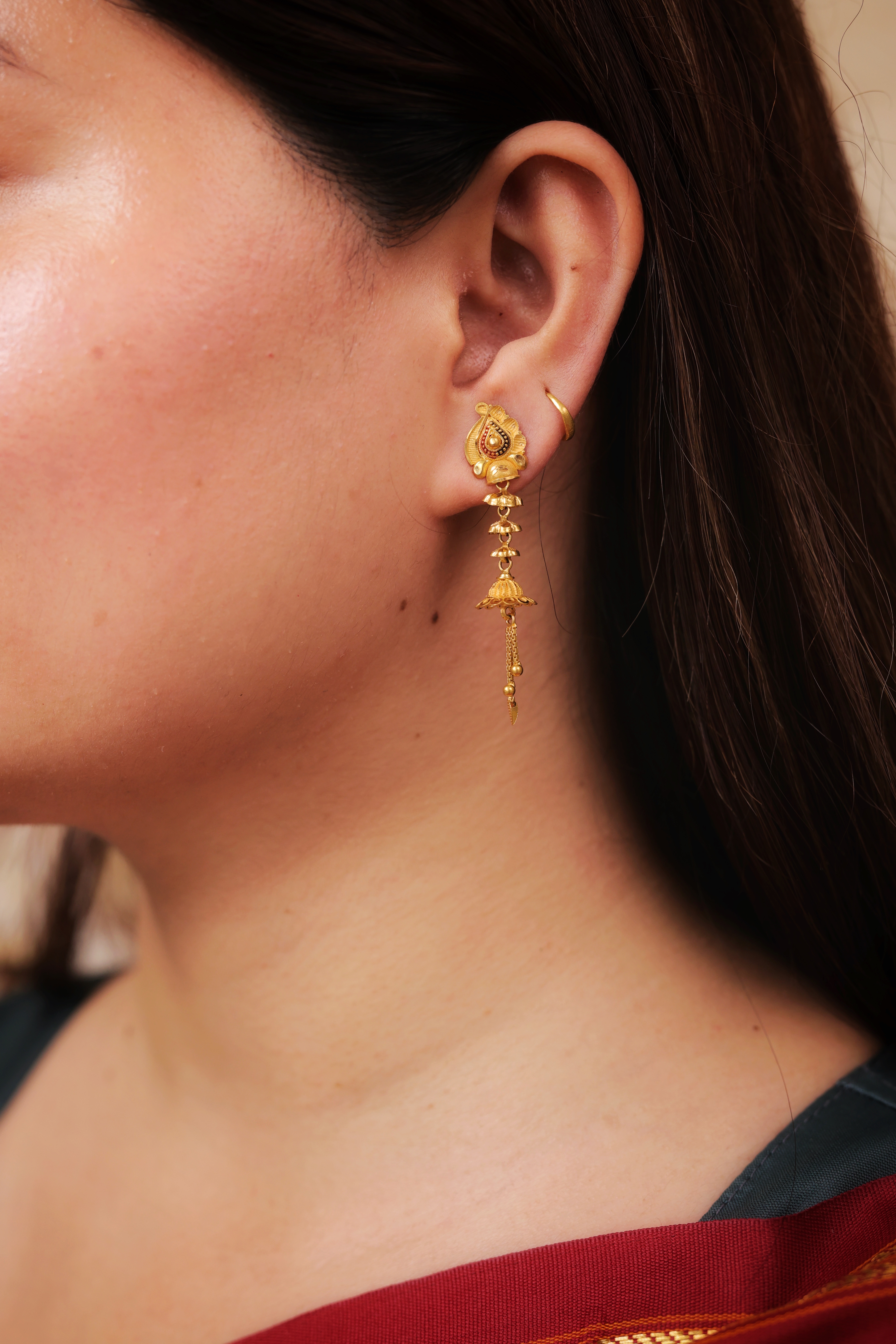 Ornate Gold Stud Earrings with Dangling Bell and Jhallar Drops