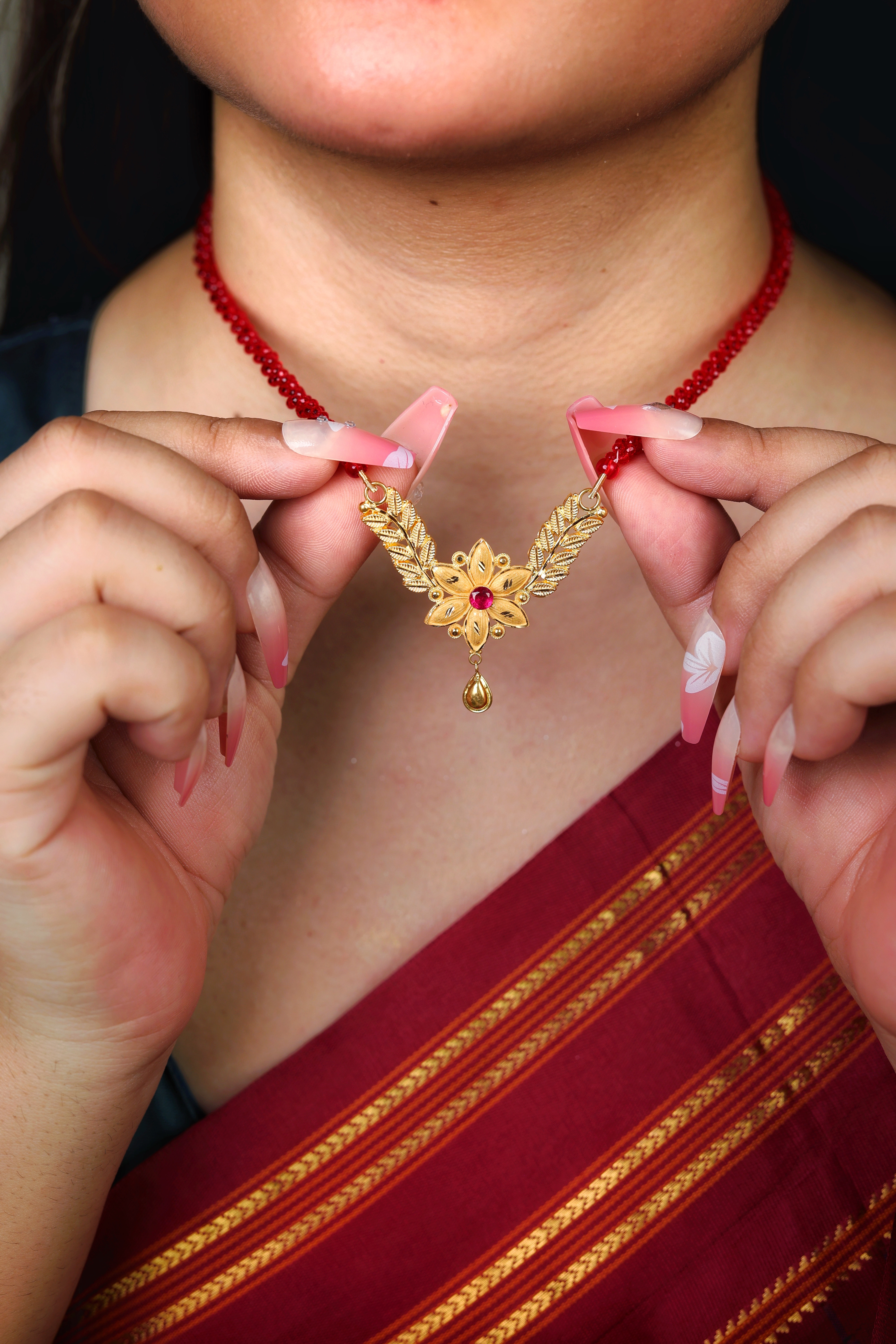 Decorative Floral Gold Pendant Mangal Sutra with Red Stone Accent