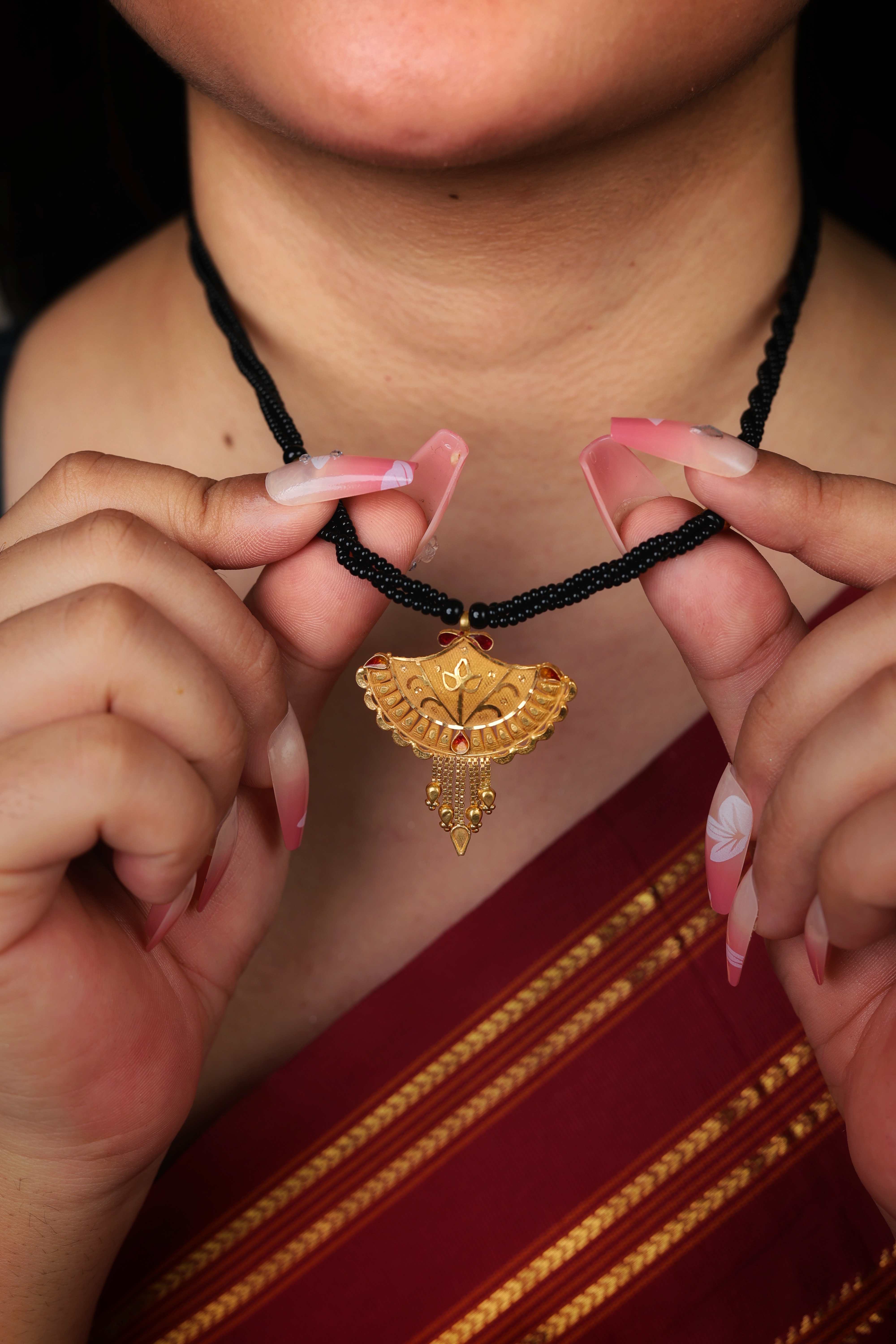 Elaborate Textured Fan-Shaped Gold Pendant Mangal Sutra with Red Accents
