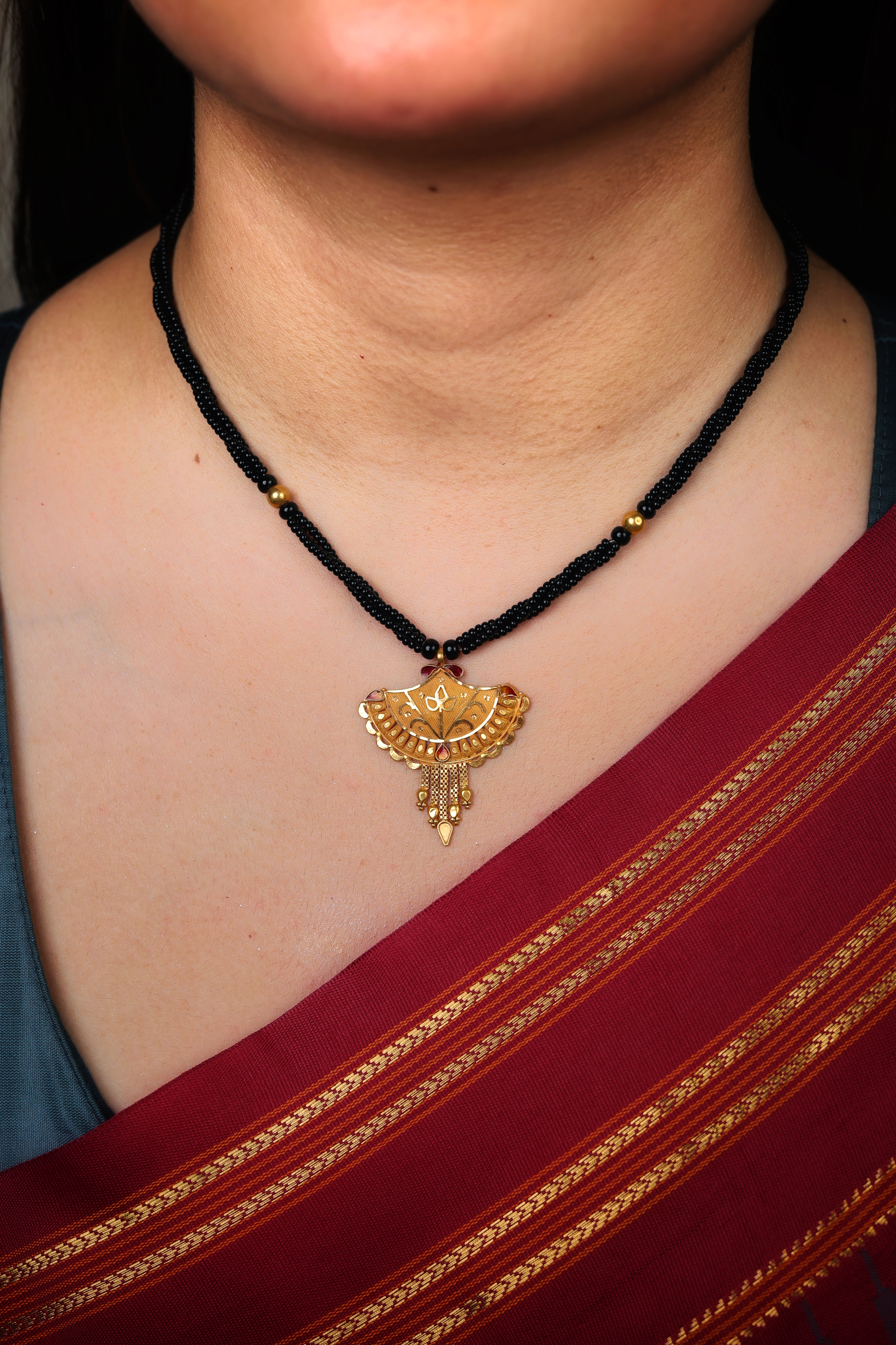 Elaborate Textured Fan-Shaped Gold Pendant Mangal Sutra with Red Accents