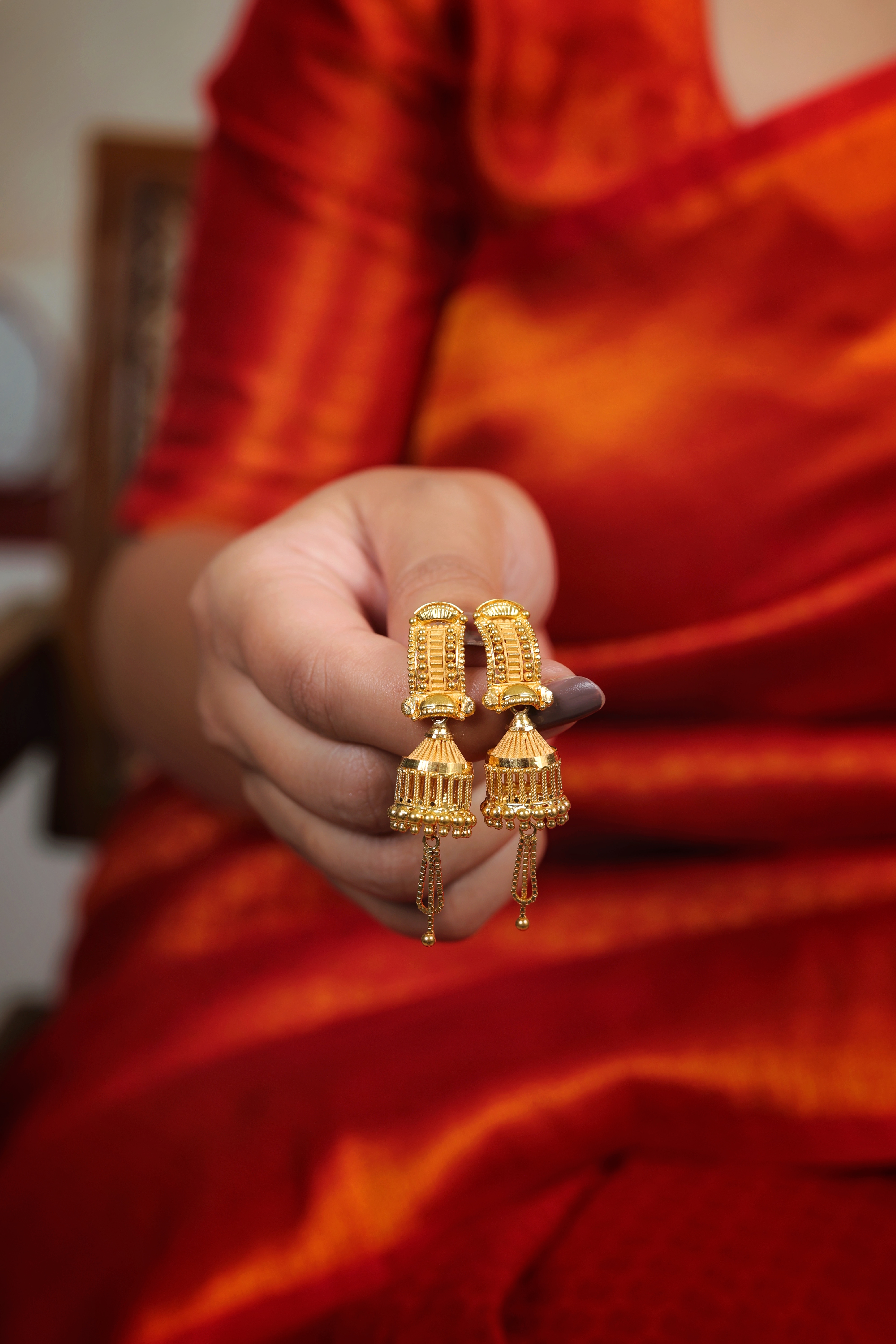 Linear Pillar-Stud Gold Jhumki Earrings with Cage Bell Drop