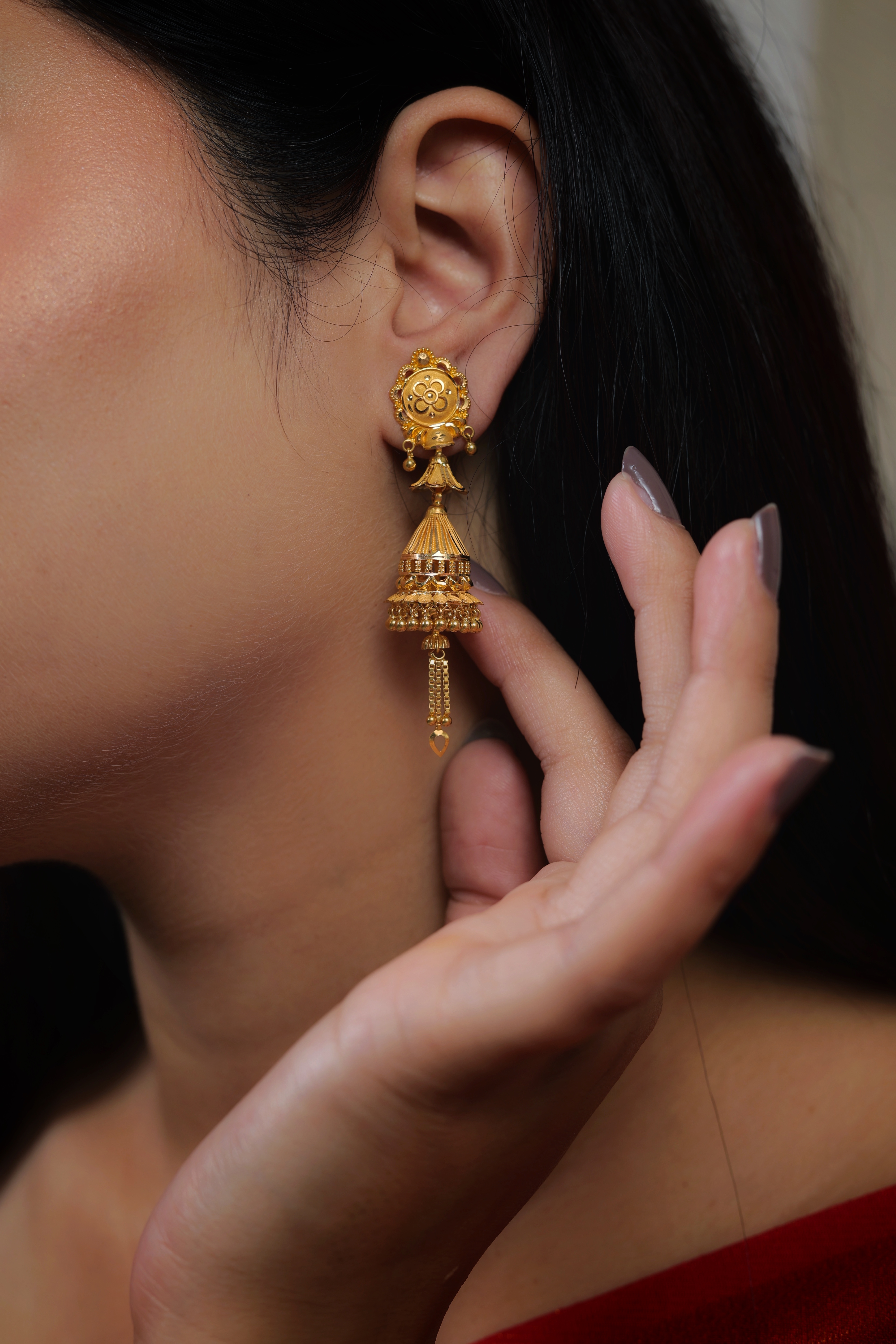 Ornate Circular Stud Gold Jhumki Earrings with Flared Trumpet Detail
