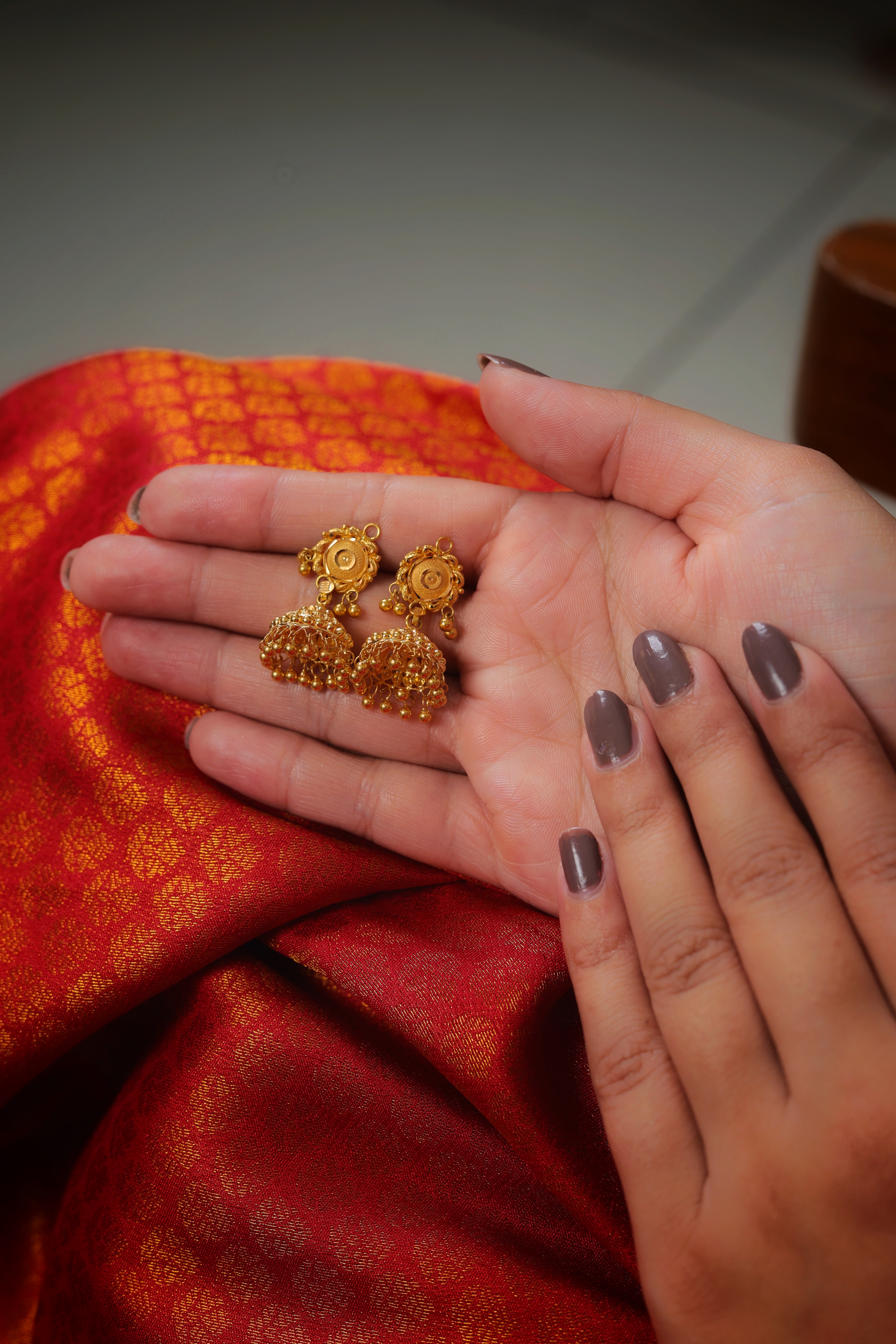 Medallion Stud Traditional Gold Jhumki Earrings with Bead-Edge Finish