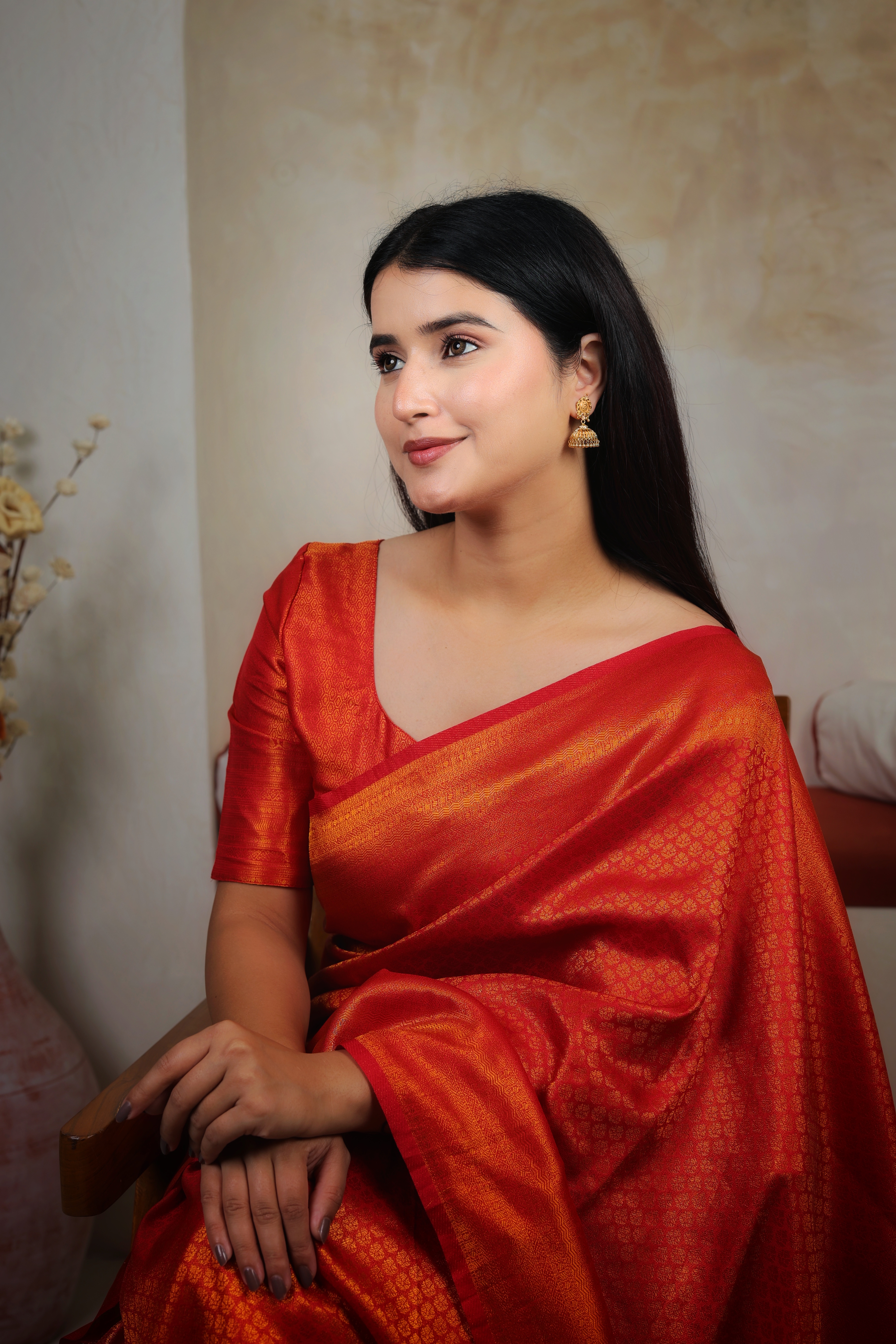 Ornate Sun-Medallion Gold Jhumki Earrings with Filigree Bell Drop