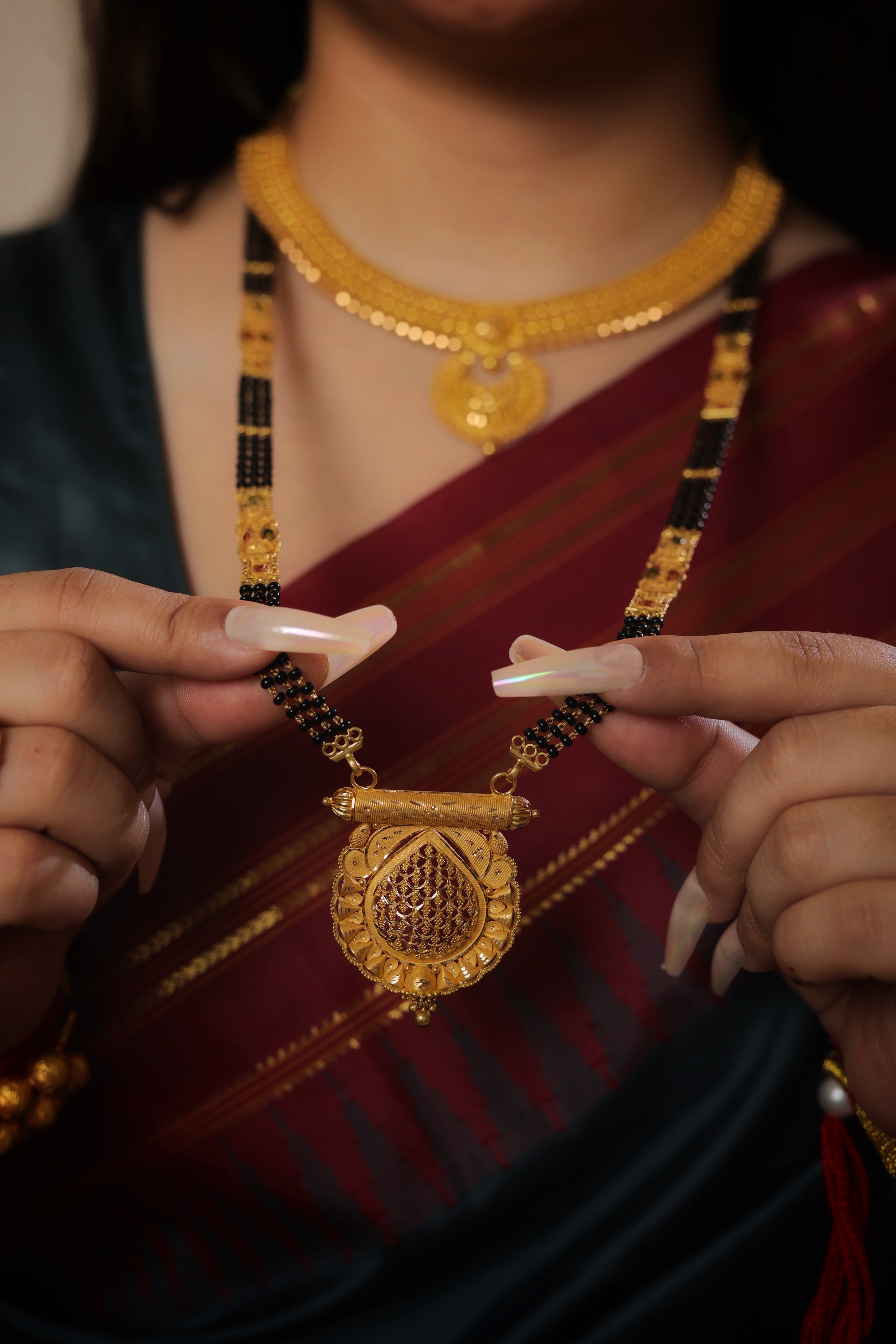 Regal Teardrop Traditional Long Mangalsutra with Sculpted Floral Frame and Ornate Spacers