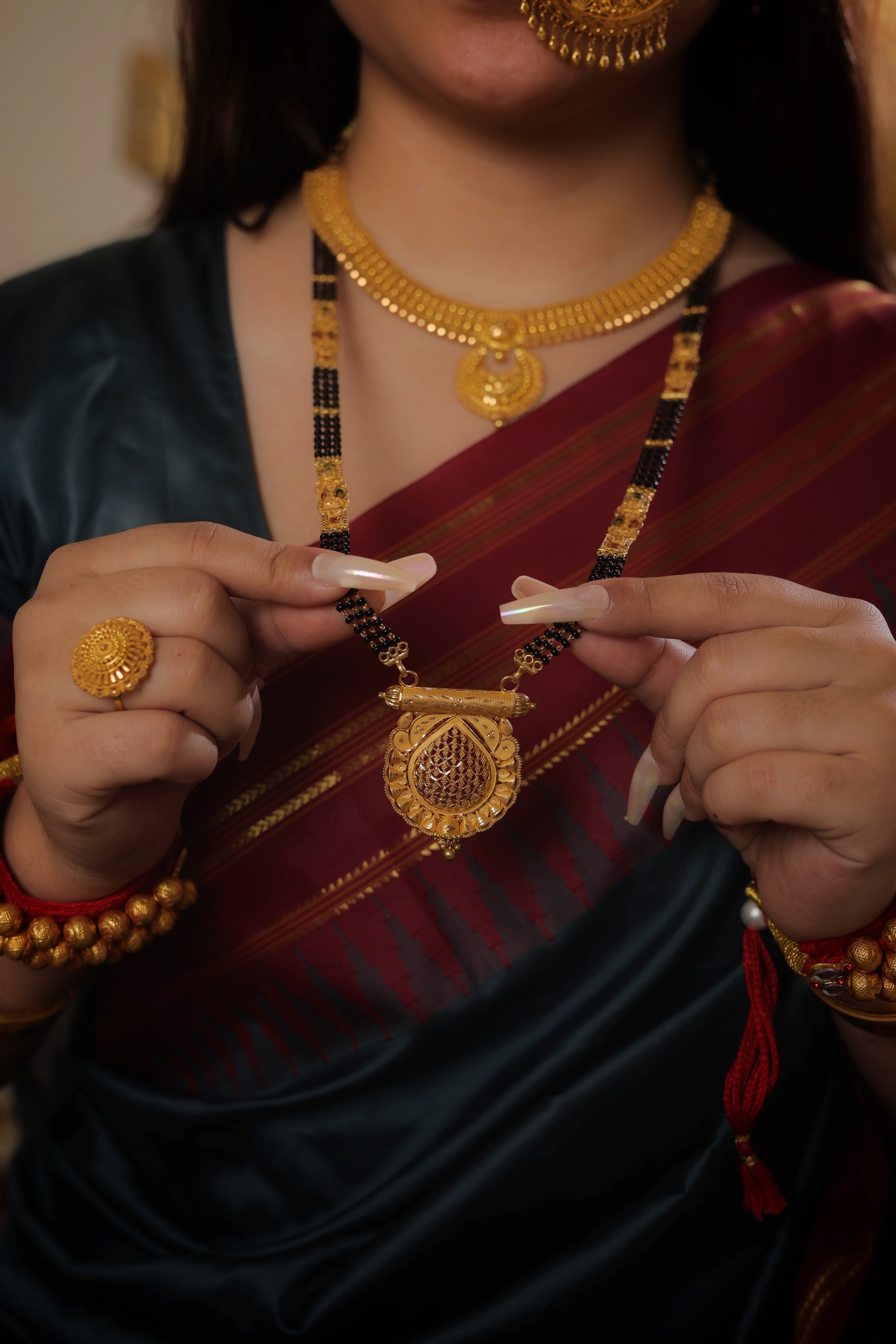 Regal Teardrop Traditional Long Mangalsutra with Sculpted Floral Frame and Ornate Spacers