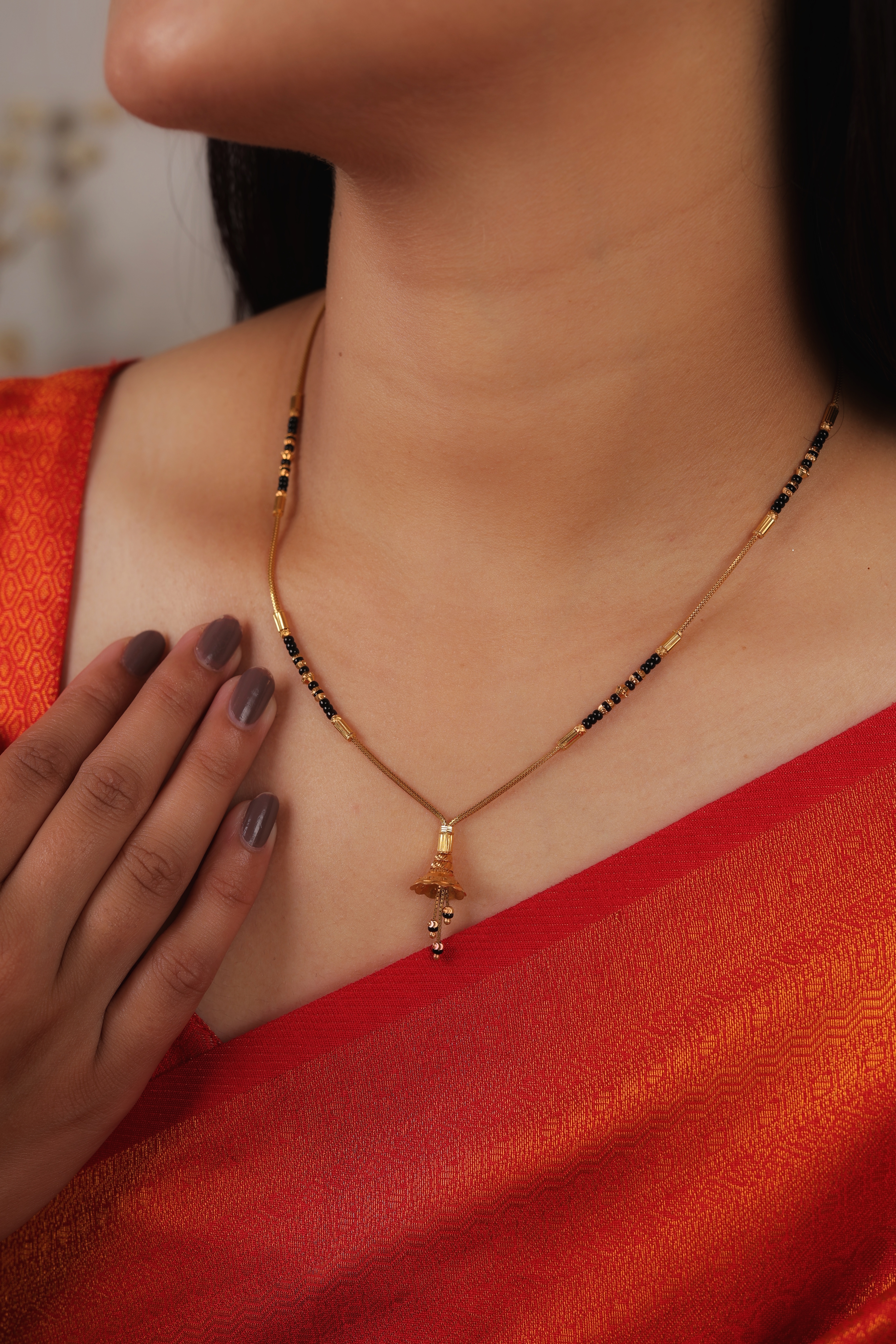 Elegant Golden Bell Short Mangalsutra with Slender Link Chain and Black Bead Accents