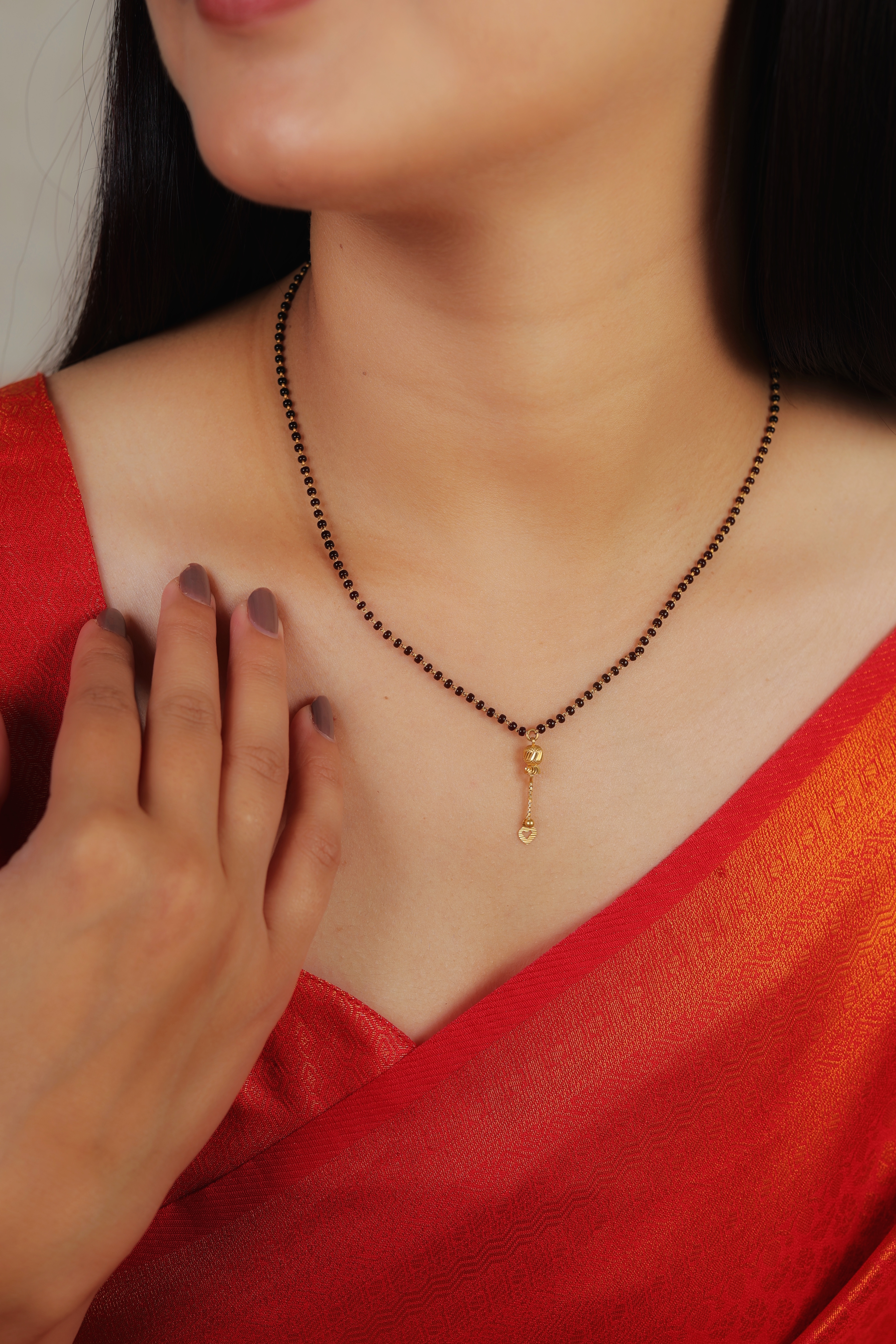 Minimalist Single-Strand Short Mangalsutra with Textured Filigree Orb and Heart Droplet