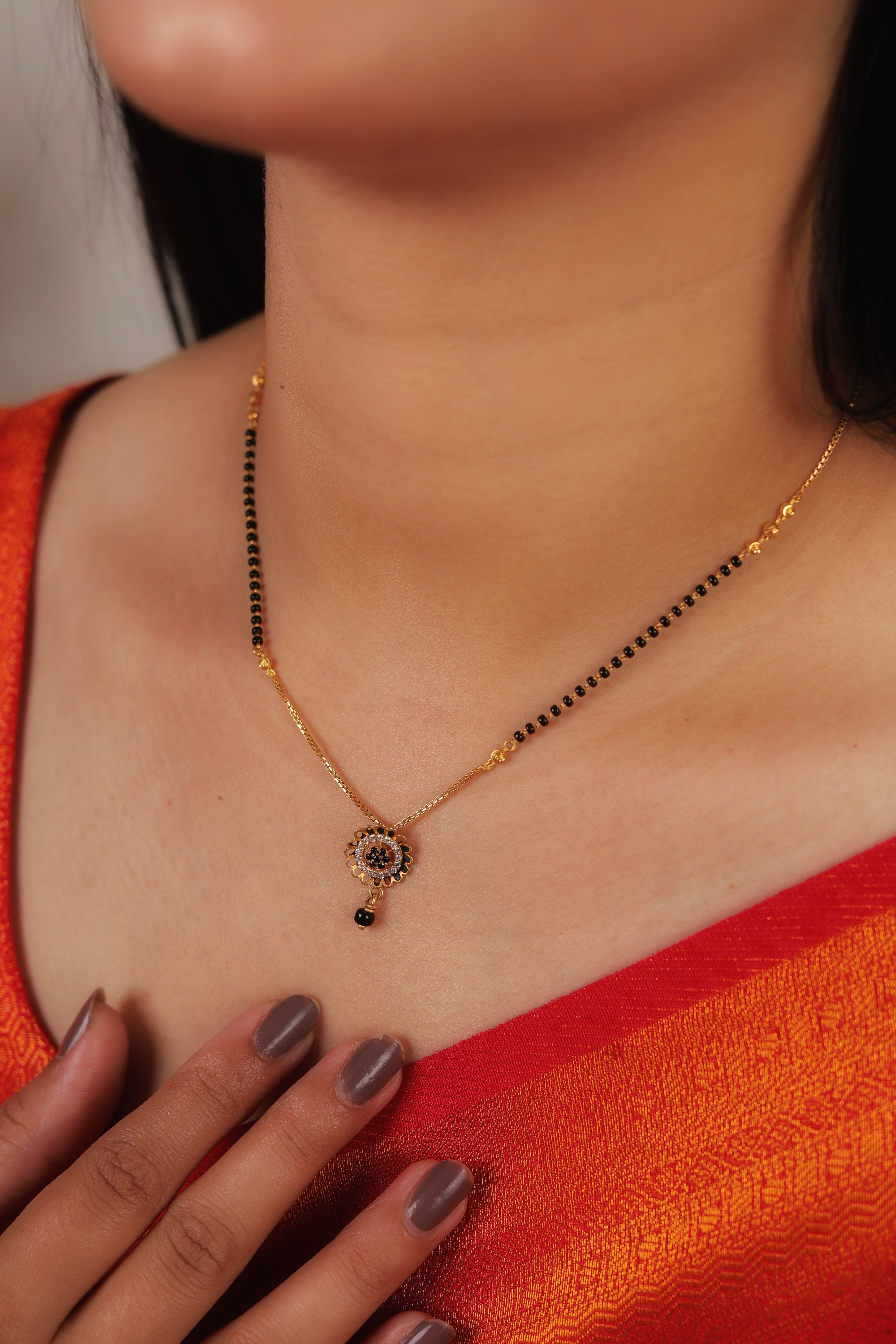 Elegant 22K Gold Short Mangalsutra with Shimmering Stone-Encrusted Floral Medallion