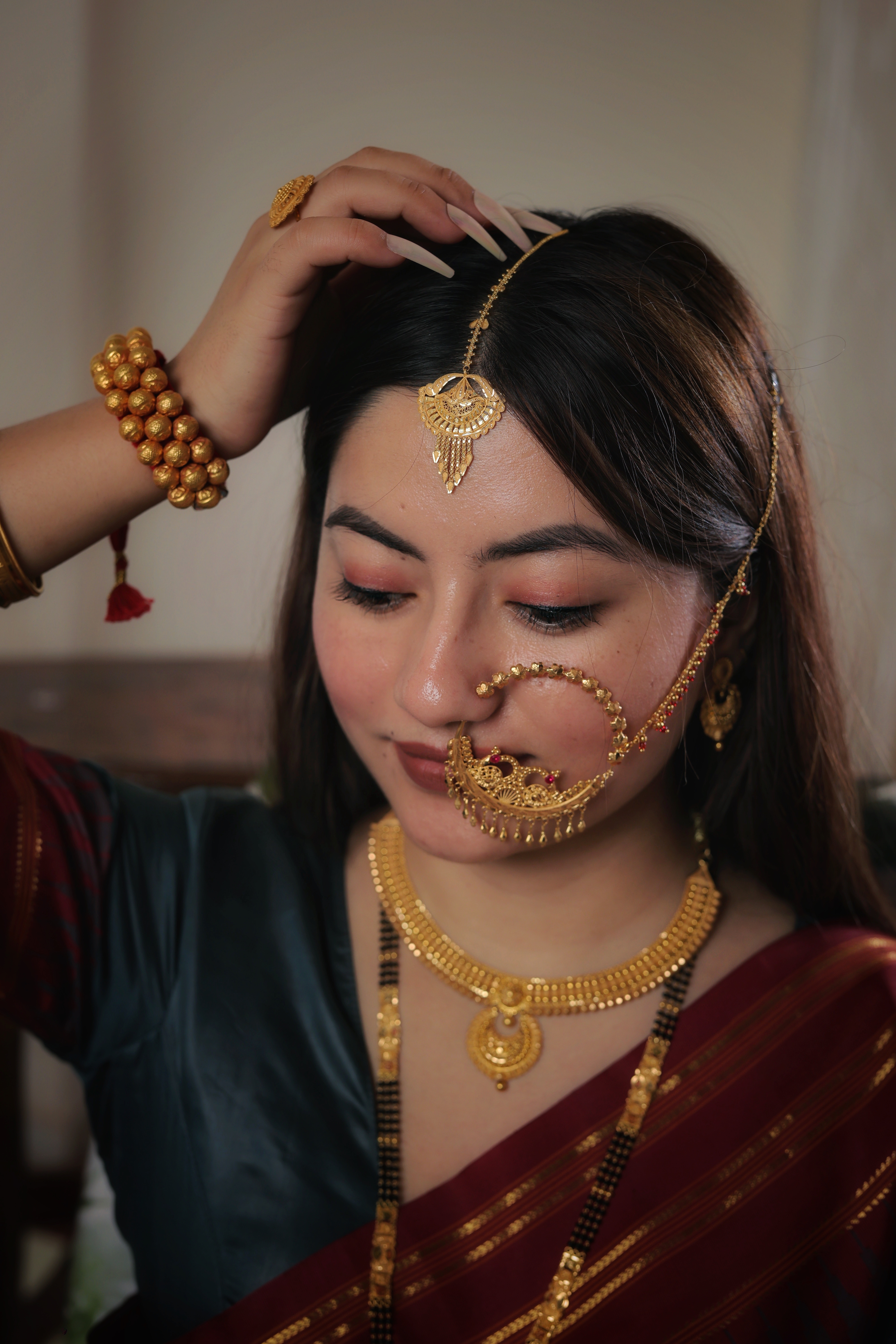 Ornate 22K Gold Chandbali Maang Tika with Intricate Filigree and Cascading Tassels