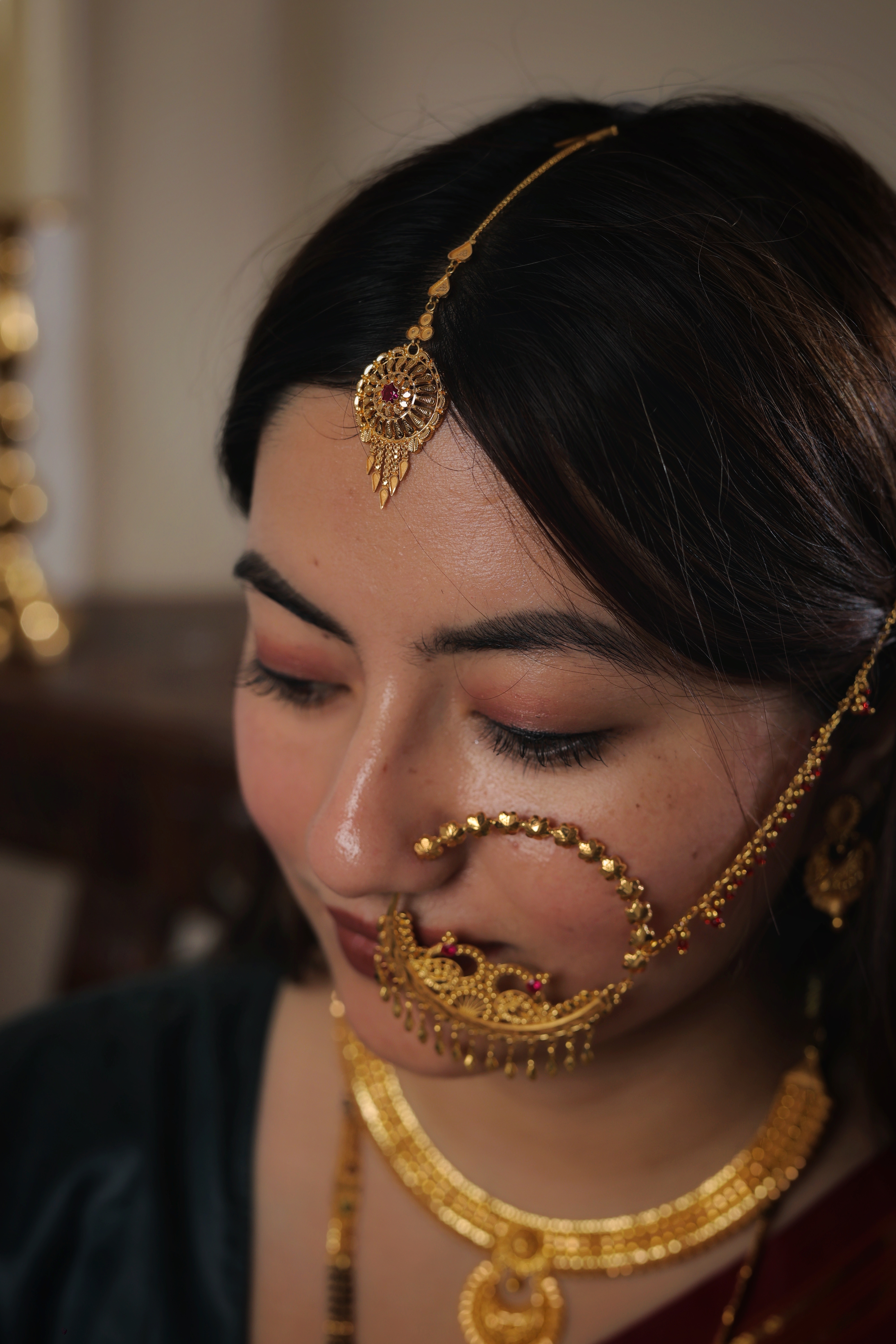 Ornate 22K Gold Circular Maang Tika with Central Ruby and Intricate Filigree Work