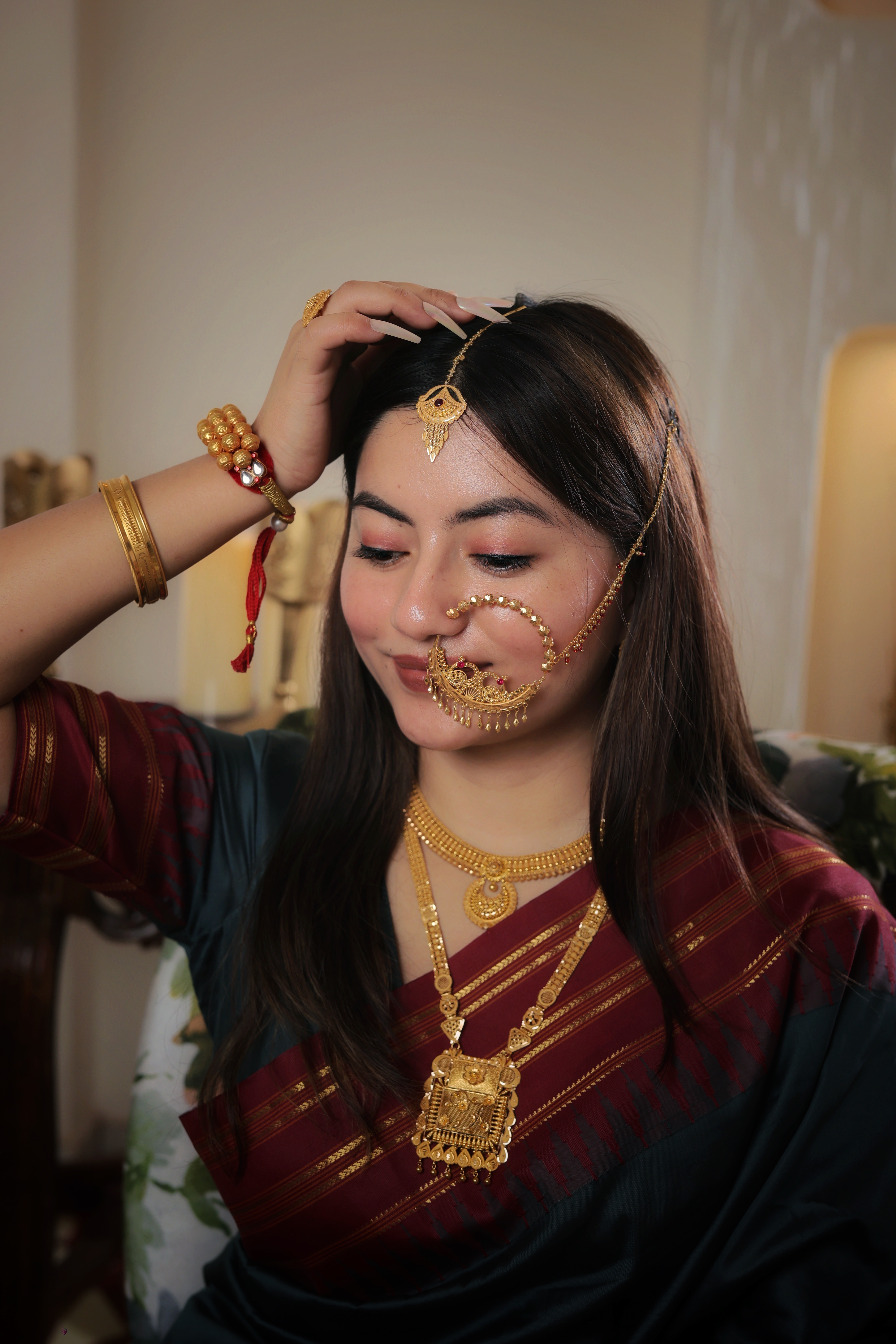 Ornate 22K Gold Ruby-Centered Chandbali Maang Tika with Intricate Filigree and Multi-Strand Tassels